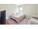 Simple bedroom features carpet and a queen bed, with natural lighting at 2026 Ellison Nw Way # 13, Kennesaw, GA 30152