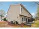Rear exterior view of the home with a patio and outdoor seating area at 2026 Ellison Nw Way # 13, Kennesaw, GA 30152