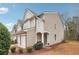 A view of the side of the townhome showing the outdoor landscape and entrance at 2026 Ellison Nw Way # 13, Kennesaw, GA 30152