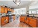 A view of the kitchen with stainless steel appliances and wooden cabinets at 2026 Ellison Nw Way # 13, Kennesaw, GA 30152