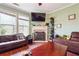 Comfortable living room featuring a fireplace and large windows, creating a welcoming atmosphere at 2026 Ellison Nw Way # 13, Kennesaw, GA 30152
