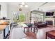 Bright living room with large sliding glass door and windows offering natural light at 2026 Ellison Nw Way # 13, Kennesaw, GA 30152