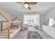 Charming bedroom featuring light grey walls, a decorative rug and natural wood A-frame bed at 3020 Barnes Mill Ct, Roswell, GA 30075