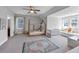 Spacious bedroom with a decorative rug, vaulted ceiling, a window nook and a framed bed at 3020 Barnes Mill Ct, Roswell, GA 30075