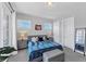 Bright bedroom with neutral decor, including french doors, large bed, and modern bedside tables at 3020 Barnes Mill Ct, Roswell, GA 30075