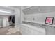 Walk-in closet with custom shelving, drawers, and ample hanging space for clothes and accessories at 3020 Barnes Mill Ct, Roswell, GA 30075