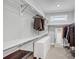 Walk-in closet with custom shelving, drawers, and ample hanging space for clothes and accessories at 3020 Barnes Mill Ct, Roswell, GA 30075