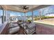 Inviting covered patio with brick flooring and comfortable seating area at 3020 Barnes Mill Ct, Roswell, GA 30075