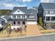 Beautifully designed two-story home with a spacious driveway, manicured lawn, and inviting curb appeal at 3020 Barnes Mill Ct, Roswell, GA 30075