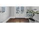 Beautiful foyer with hardwood floors and white double doors leading to the outside at 3020 Barnes Mill Ct, Roswell, GA 30075