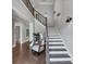 Inviting foyer with hardwood floors, staircase with iron railings, and stylish decor at 3020 Barnes Mill Ct, Roswell, GA 30075