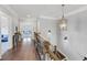 Upstairs hallway with decorative lighting and views of the downstairs living area, creates a seamless flow at 3020 Barnes Mill Ct, Roswell, GA 30075