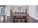 Open kitchen and dining area featuring wood floors, cabinets, a large island, and modern lighting at 3020 Barnes Mill Ct, Roswell, GA 30075