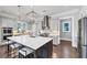 Spacious open kitchen with an oversized island, stainless appliances, and custom cabinetry at 3020 Barnes Mill Ct, Roswell, GA 30075