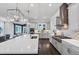 Open kitchen featuring a large island, stainless steel appliances, and light gray cabinets at 3020 Barnes Mill Ct, Roswell, GA 30075