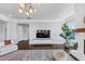 Bright living room with modern fireplace, built-in storage, and large window for natural light, creating a welcoming space at 3020 Barnes Mill Ct, Roswell, GA 30075