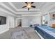 Primary bedroom with large tray ceiling, plenty of space, and natural light, creating a serene environment at 3020 Barnes Mill Ct, Roswell, GA 30075