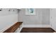 Functional mudroom with custom built-in bench, hooks, and storage, providing organization and convenience at 3020 Barnes Mill Ct, Roswell, GA 30075