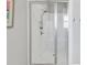 Modern glass shower with white subway tile and a built-in bench at 3020 Barnes Mill Ct, Roswell, GA 30075
