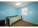 This cozy bedroom features natural light and a neutral color palette at 4130 N Quail Dr, Douglasville, GA 30135