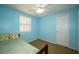 This cozy bedroom features natural light and a neutral color palette at 4130 N Quail Dr, Douglasville, GA 30135