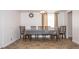 Traditional dining room with a table set for six, featuring tile floors, a ceiling fan, and natural light at 4130 N Quail Dr, Douglasville, GA 30135