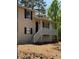 Charming two-story home featuring neutral siding, black shutters, and a cozy front porch at 4130 N Quail Dr, Douglasville, GA 30135