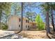 This split-level home has neutral siding, black shutters, a covered front porch, and an attached garage at 4130 N Quail Dr, Douglasville, GA 30135
