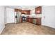 Eat-in kitchen featuring stainless steel appliances, cherry wood cabinets, and tile flooring at 4130 N Quail Dr, Douglasville, GA 30135