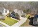 Overhead shot of a landscaped house with a spacious driveway and an attached two car garage at 5977 Wildcreek Rd, Sugar Hill, GA 30518