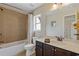 Well-maintained bathroom with tub-shower combination and vanity with mirror and sink at 5977 Wildcreek Rd, Sugar Hill, GA 30518