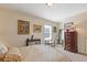 Cozy bedroom with decor art, including a dresser and a view of the window at 5977 Wildcreek Rd, Sugar Hill, GA 30518