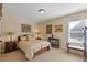 Comfortable bedroom featuring a queen-size bed, bedside tables, and natural light at 5977 Wildcreek Rd, Sugar Hill, GA 30518