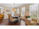 Dining area with large windows, hardwood floors, and direct access to the outdoors at 5977 Wildcreek Rd, Sugar Hill, GA 30518