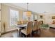 Dining room with hardwood floors, large windows, and comfortable seating at 5977 Wildcreek Rd, Sugar Hill, GA 30518