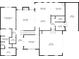 First floor plan showcasing the layout of the living room, kitchen, primary bedroom, and garage at 5977 Wildcreek Rd, Sugar Hill, GA 30518