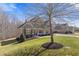 A beautiful two-story home with lush green grass and well-maintained landscaping at 5977 Wildcreek Rd, Sugar Hill, GA 30518