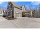 Three car garage with two large parking bays and one small parking bay on the side of the house at 5977 Wildcreek Rd, Sugar Hill, GA 30518