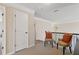 Upstairs hallway with seating area and a view of doors leading to bedrooms or bathrooms at 5977 Wildcreek Rd, Sugar Hill, GA 30518