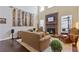Bright living room with stone fireplace, high ceilings, and hardwood flooring at 5977 Wildcreek Rd, Sugar Hill, GA 30518
