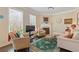 Cozy living room with comfortable seating, natural light, and fireplace at 5977 Wildcreek Rd, Sugar Hill, GA 30518