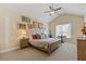Tranquil main bedroom with vaulted ceiling, neutral tones, and ample natural light at 5977 Wildcreek Rd, Sugar Hill, GA 30518