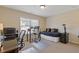 Spacious home office area with ample natural light and carpeted floors at 5977 Wildcreek Rd, Sugar Hill, GA 30518