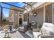 Cozy covered patio with comfortable seating, perfect for outdoor relaxation and entertaining guests at 5977 Wildcreek Rd, Sugar Hill, GA 30518