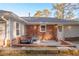 Backyard with patio, red brick details, green grass and a covered area perfect for outdoor entertaining at 1893 Windsor Sw Dr, Atlanta, GA 30311