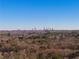 Expansive view of the city skyline over lush tree tops, a scenic vista from a serene vantage point at 1893 Windsor Sw Dr, Atlanta, GA 30311