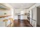 Bright kitchen with stainless steel appliances, white cabinets, and a breakfast bar at 1893 Windsor Sw Dr, Atlanta, GA 30311