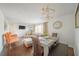 Open-concept living and dining area features stylish furniture and a comfortable layout at 1893 Windsor Sw Dr, Atlanta, GA 30311