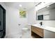 Modern bathroom featuring sleek fixtures, a stylish vanity, and a glass-enclosed shower at 681 Fielding Sw Ln, Atlanta, GA 30311
