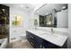 Bright bathroom with dual sink vanity, modern fixtures, and marble countertops at 681 Fielding Sw Ln, Atlanta, GA 30311